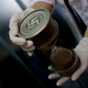 A member of the federal police holds an hourglass with Nazi markings at the Interpol headquarters in Buenos Aires, Argentina (AP Photo/Natacha Pisarenko)
